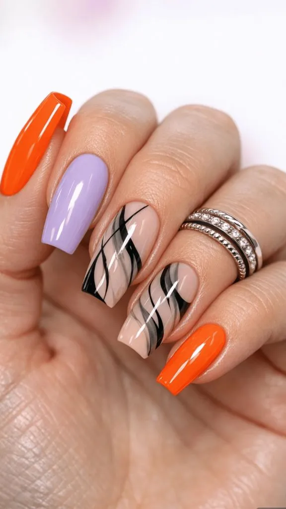 Coffin nails with orange, lavender, and abstract black wave art