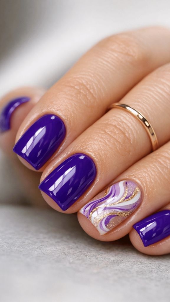 Vibrant royal purple nails with one marble swirl accent nail in purple, white, and gold