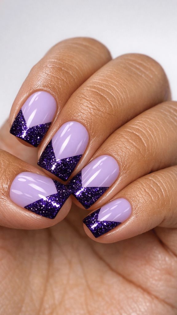 Lavender nails with deep purple glitter chevron tips forming a V-shape