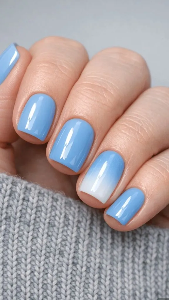 Short square nails in sky blue with white ombré accent nail