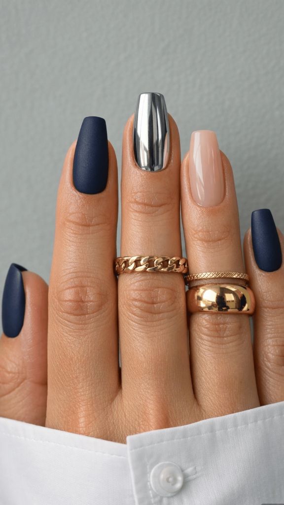 Coffin nails in matte navy with silver chrome and nude accent nails