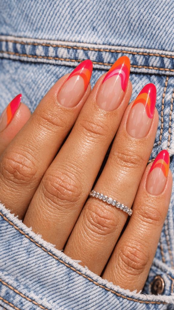 Almond nails with pink, orange, and red swirl French tips