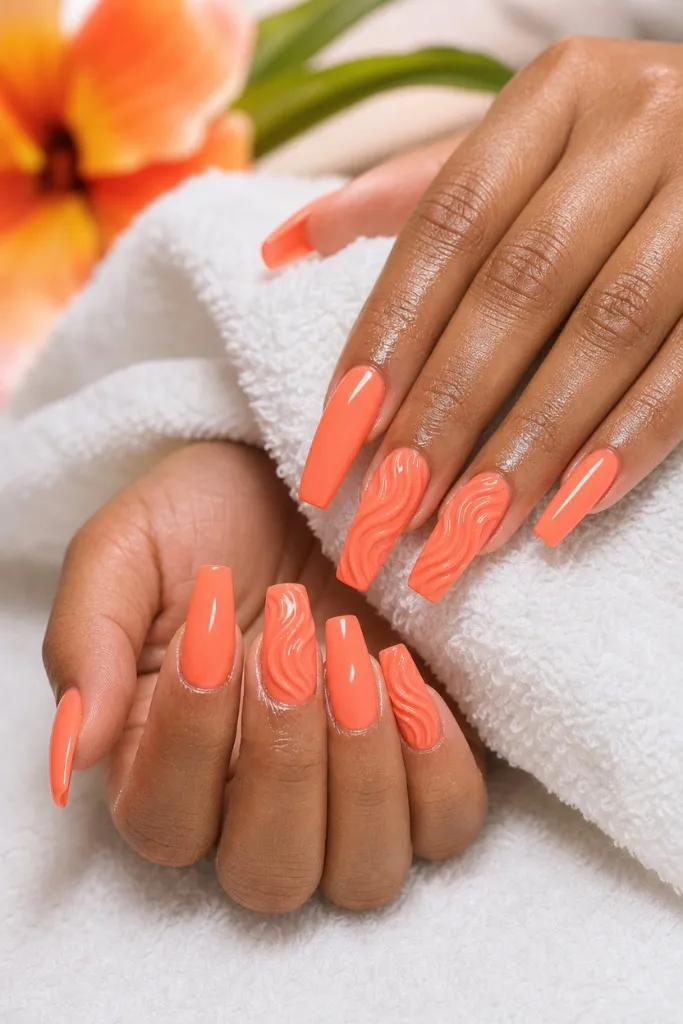 Coral Wave Sculpture nails for summer. Summer vibes nails 2026 in vibrant coral with 3D textured accents.