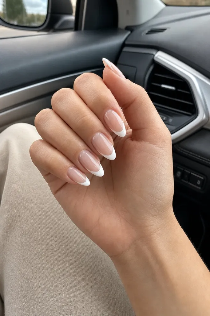 Classic Almond French nails for summer. Summer vibes nails 2026 with crisp white French tips on almond shape.