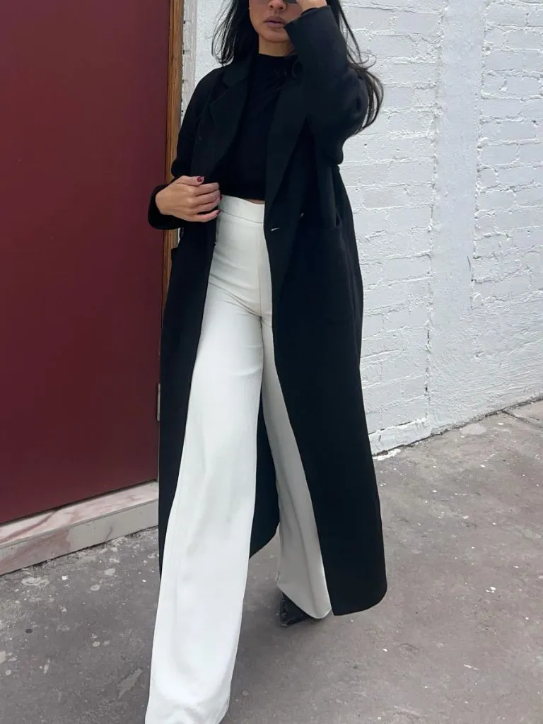 Black coat with white wide-leg pants