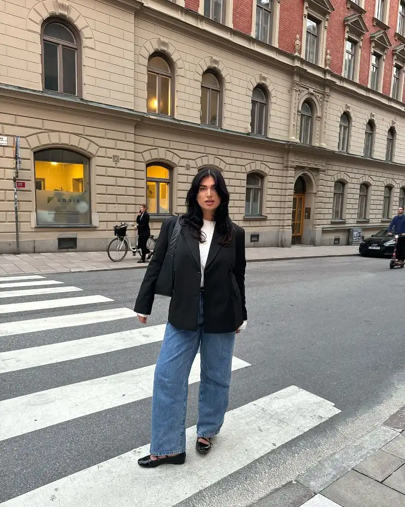 Black blazer with wide-leg jeans and loafers
