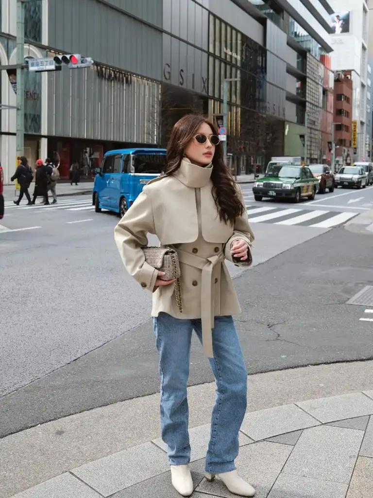 Beige belted jacket with jeans in Japan