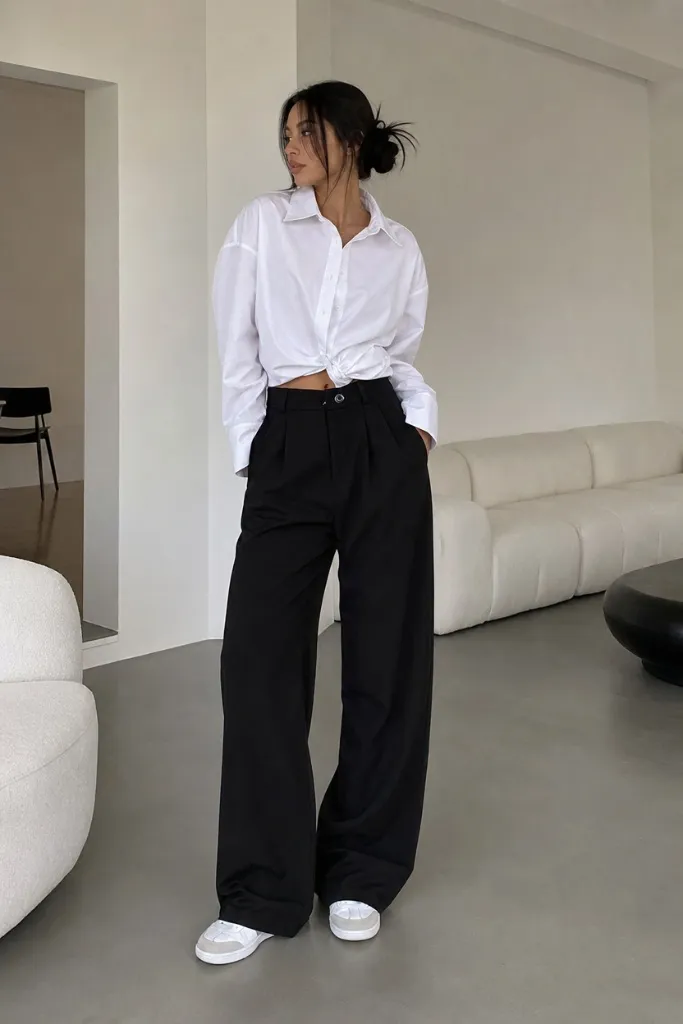 Fall outfit with white knotted button-down and black wide-leg trousers