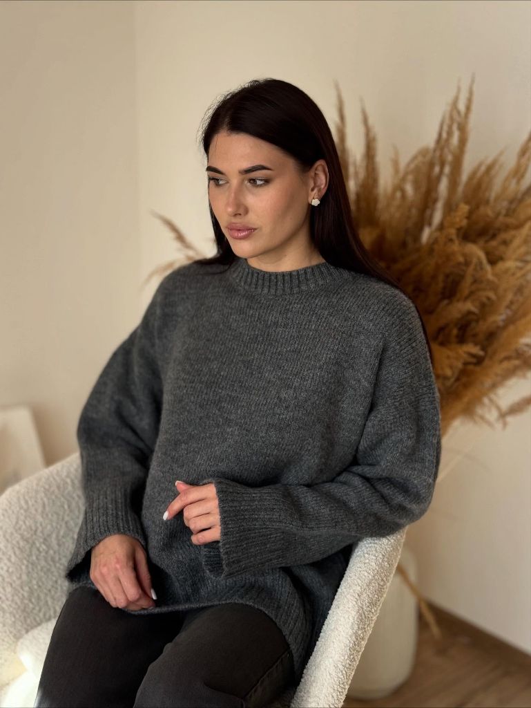Dark charcoal oversized crewneck sweater with black trousers