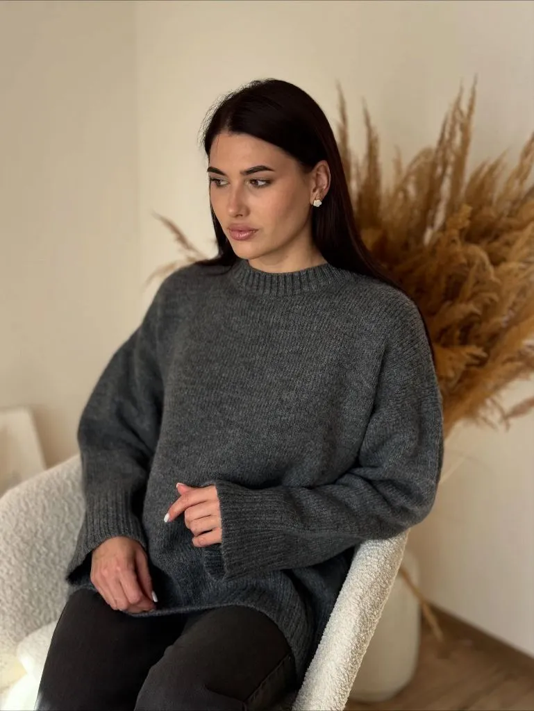 Dark charcoal oversized crewneck sweater with black trousers