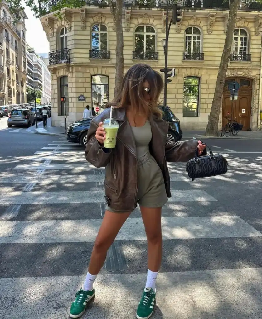 Brown leather jacket with green sneakers