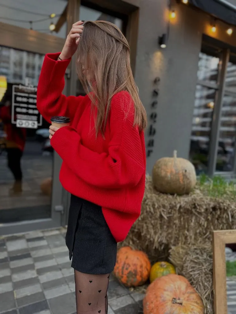 Red oversized sweater with black mini skirt