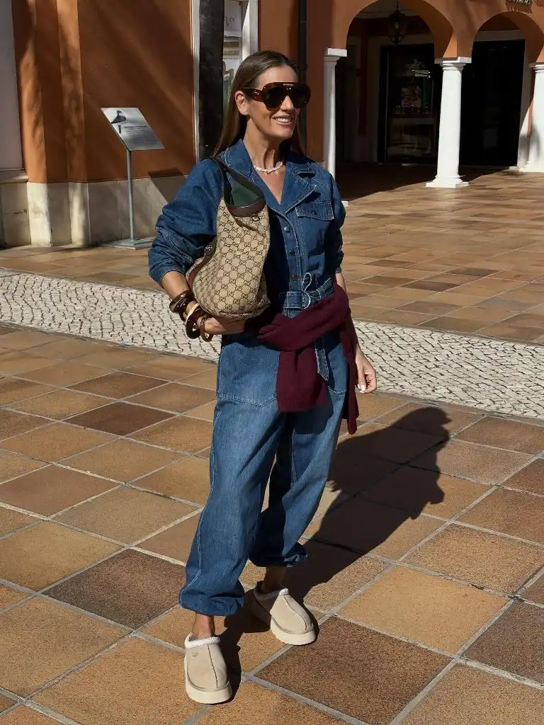 Denim shirt and jeans with Gucci bag, burgundy sweater and shearling slippers
