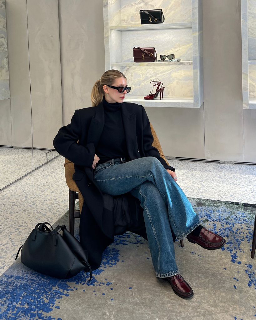 Black coat and jeans in luxury store