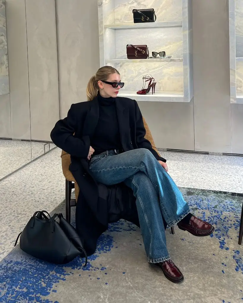 Black coat and jeans in luxury store