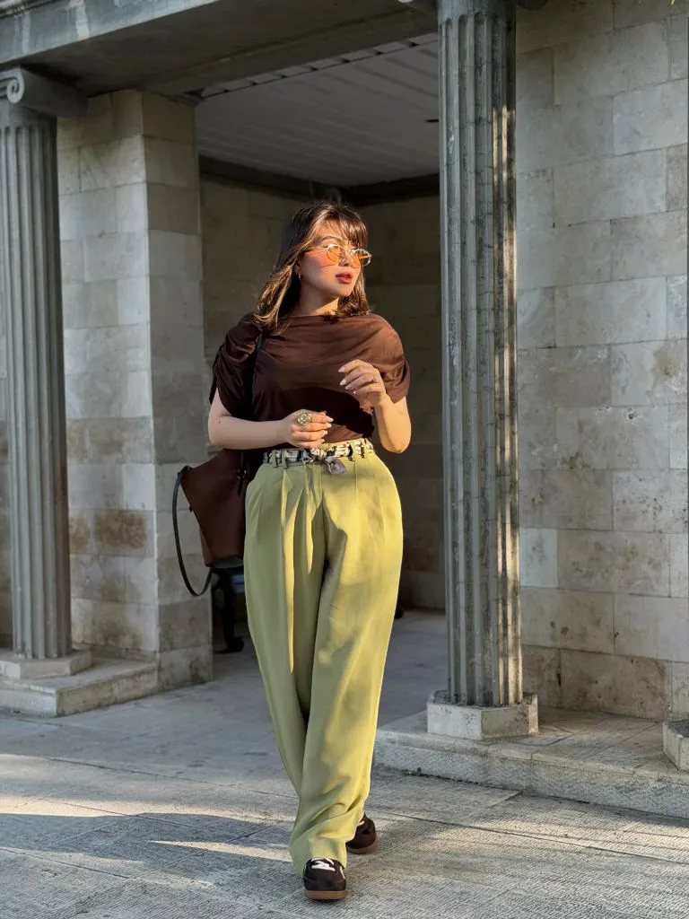 Fall outfit with brown top and green wide-leg trousers