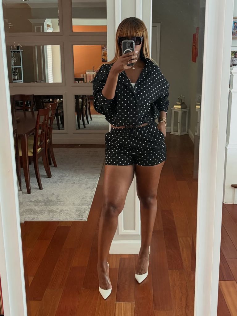 Black and white polka dot blazer and shorts co-ord with white pointed heels