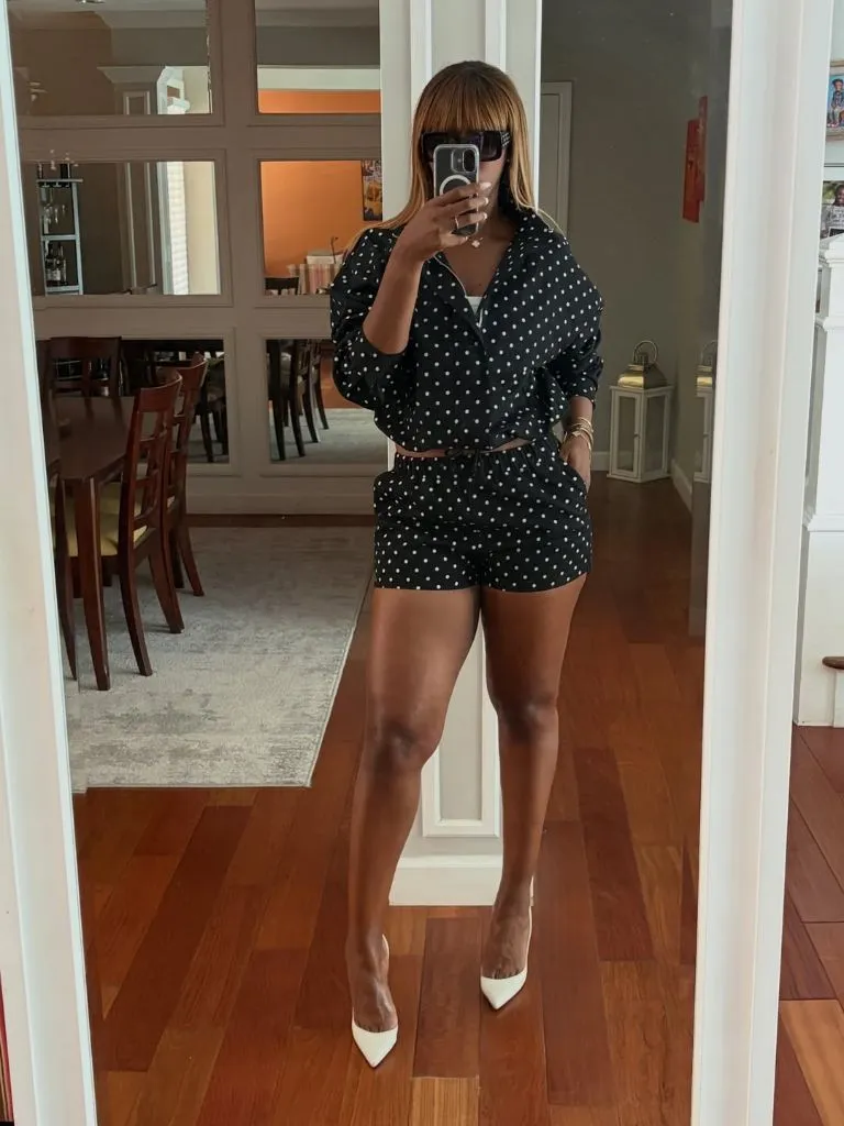 Black and white polka dot blazer and shorts co-ord with white pointed heels