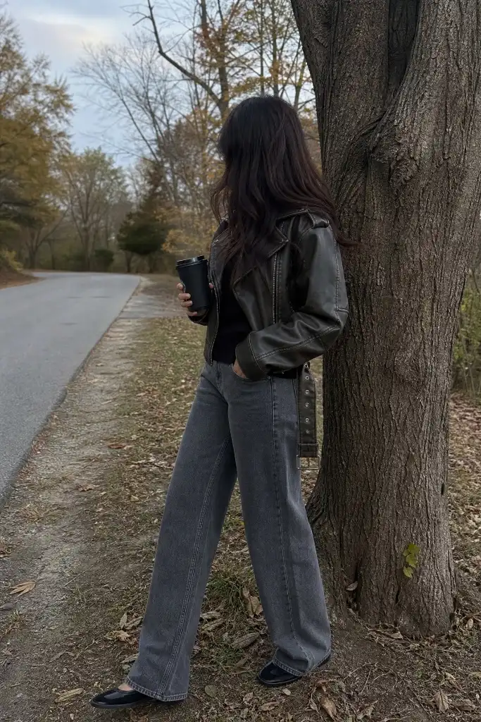 Distressed leather jacket with grey wide jeans