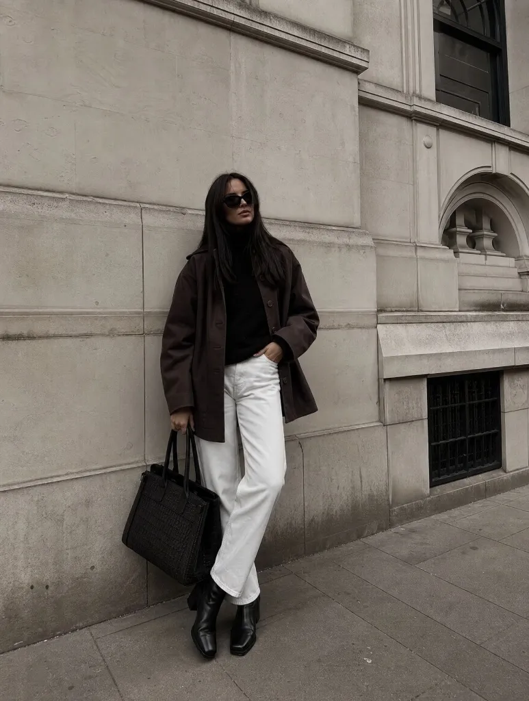 Dark brown overshirt with black turtleneck and white jeans
