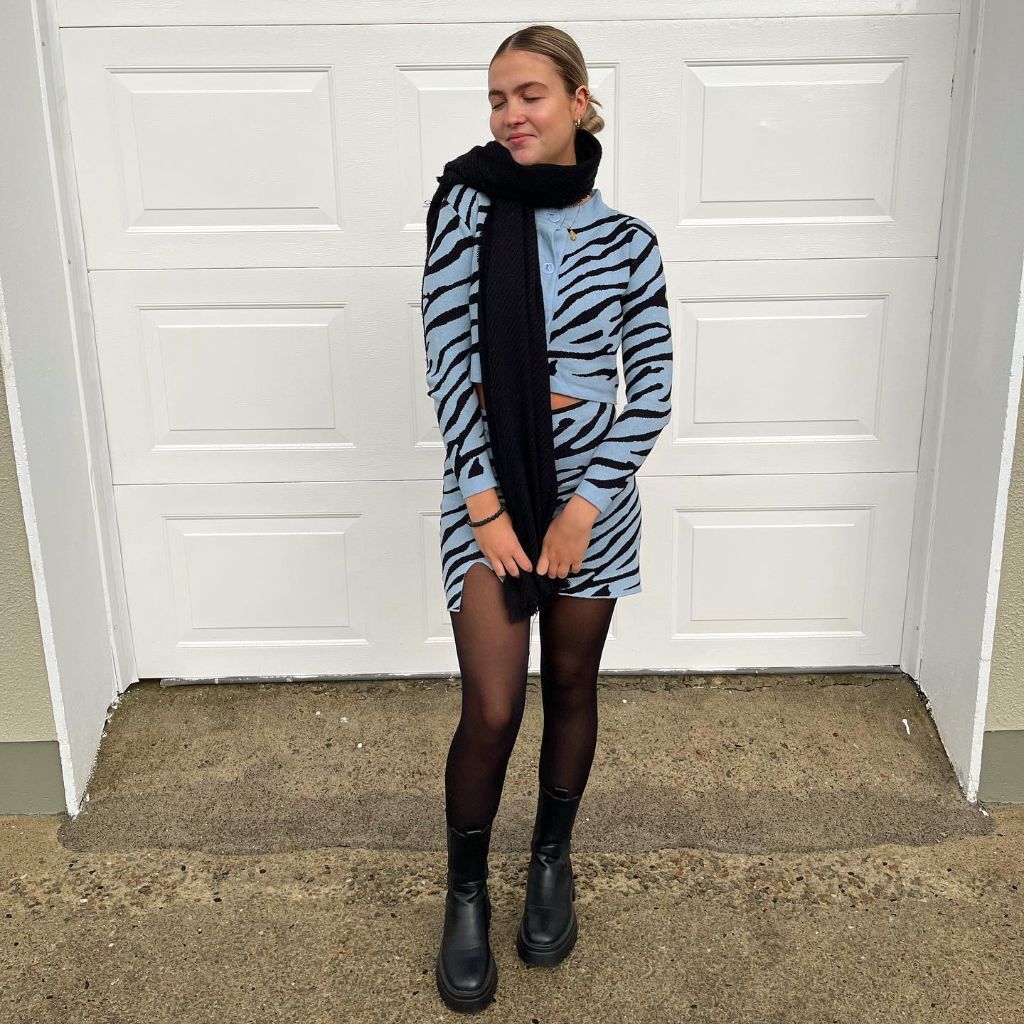 Blue and black zebra print co-ord set with black tights and boots