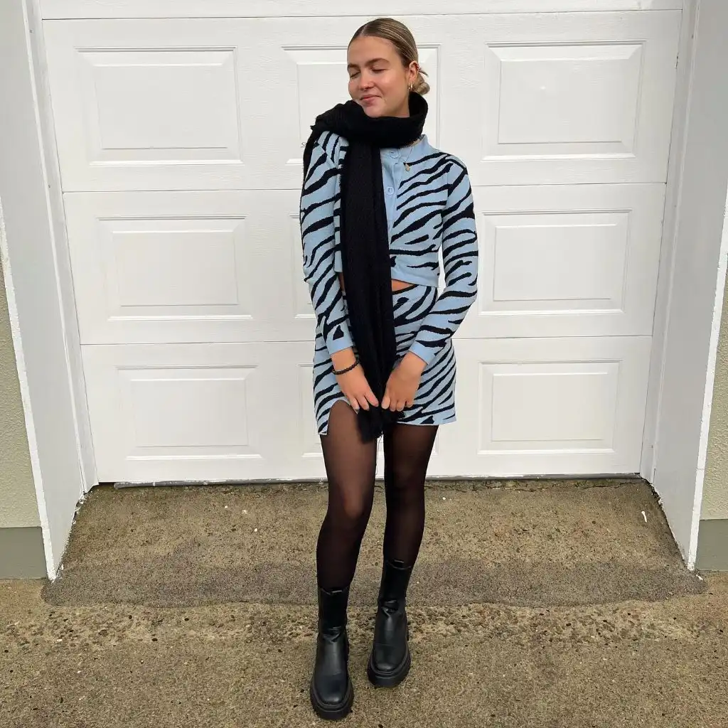 Blue and black zebra print co-ord set with black tights and boots