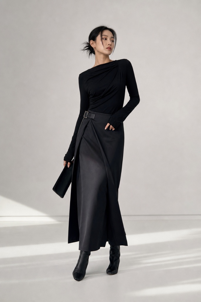 Black draped top with black wrap midi skirt and boots