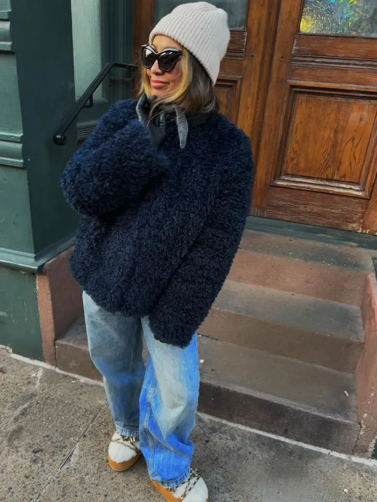 Navy sherpa jacket with jeans and beanie