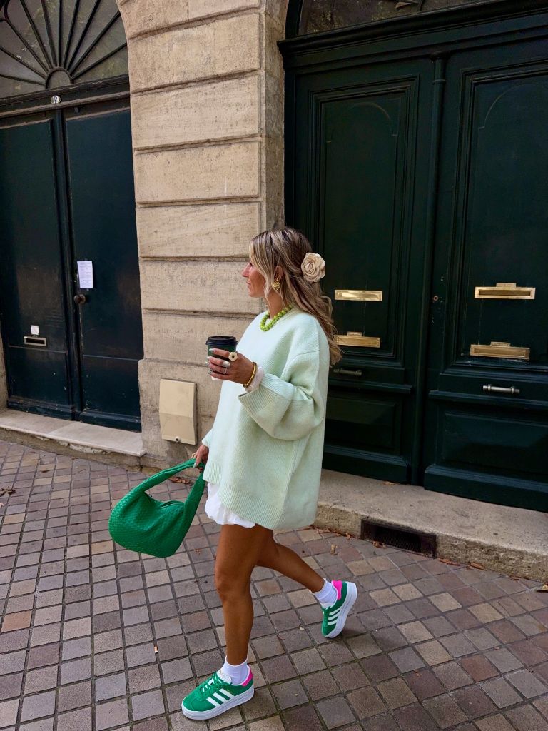 Mint green oversized sweater, white skirt, green Adidas and green woven bag