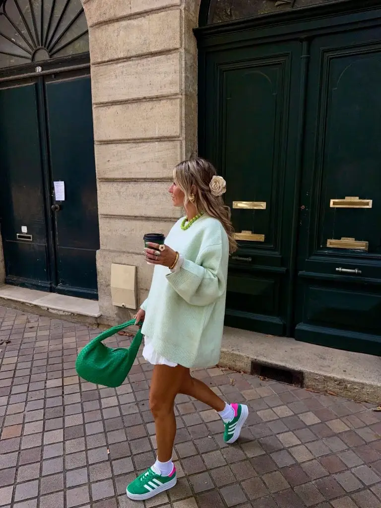 Mint green oversized sweater, white skirt, green Adidas and green woven bag