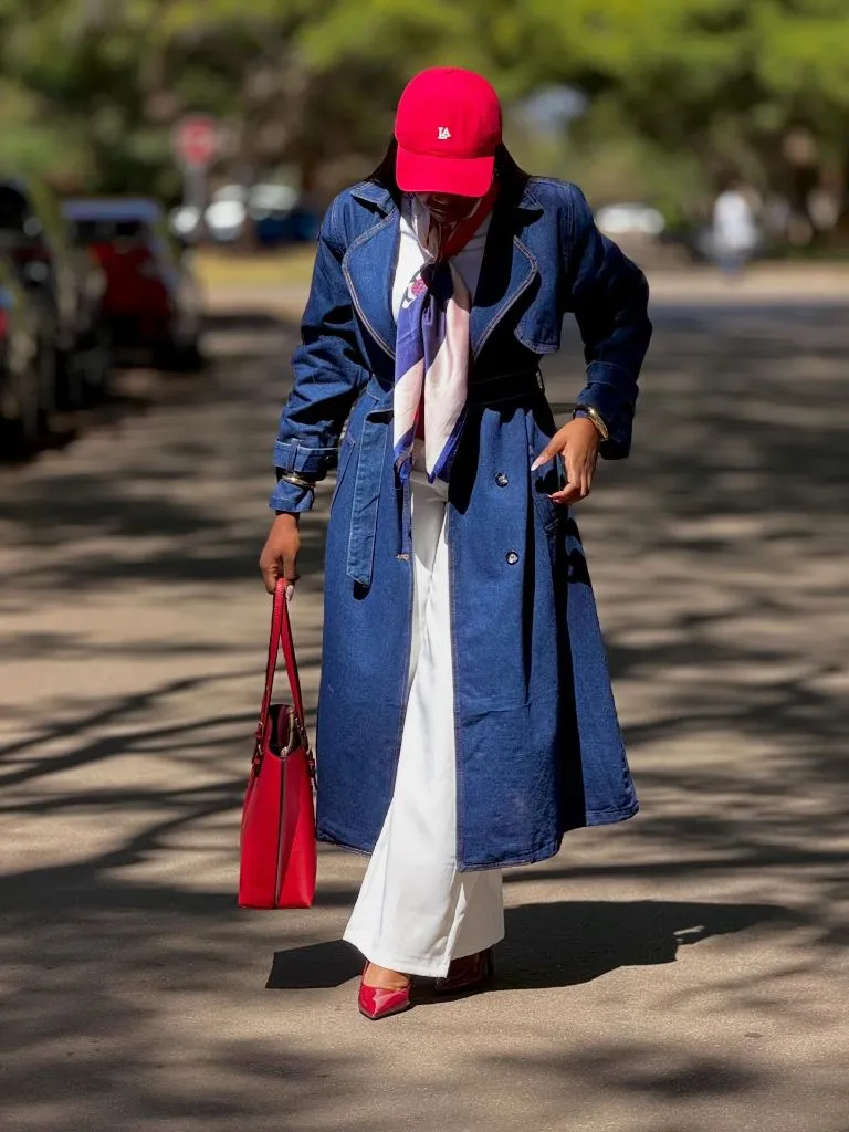 Denim trench coat with red accessories