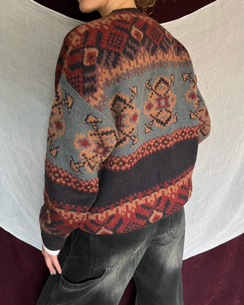 Vintage-style fair isle patterned sweater with dark jeans