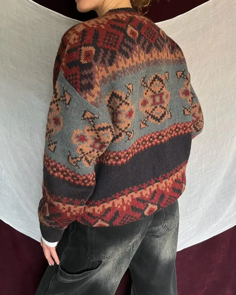Vintage-style fair isle patterned sweater with dark jeans