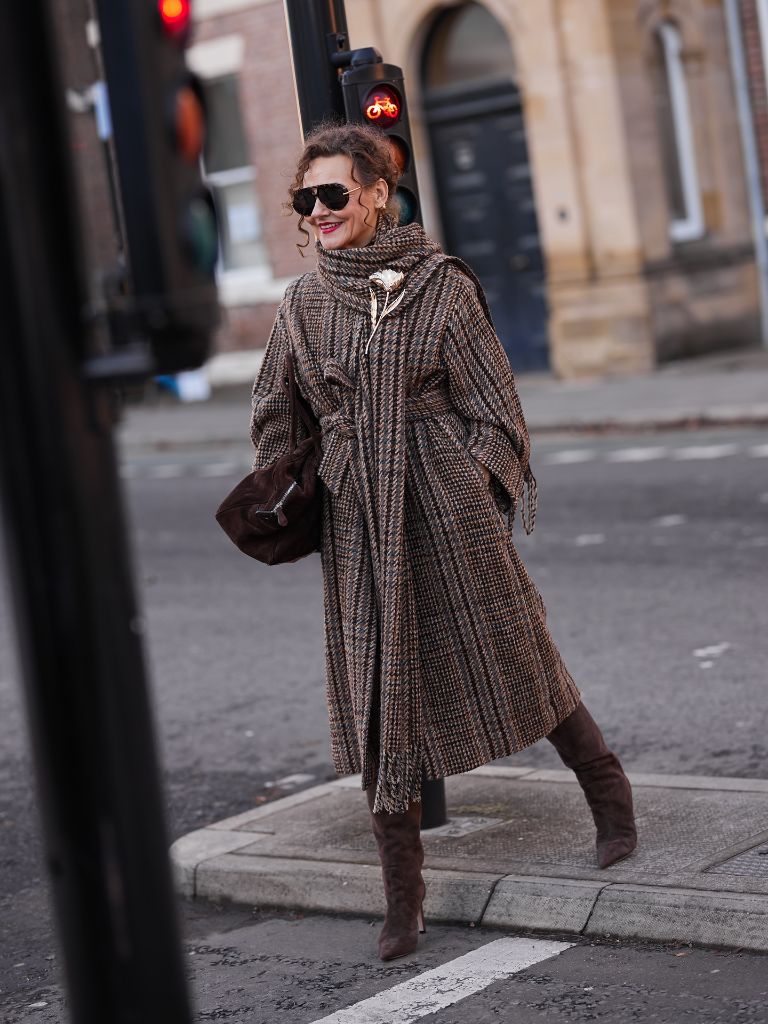 Brown tweed oversized coat with suede boots and brooch