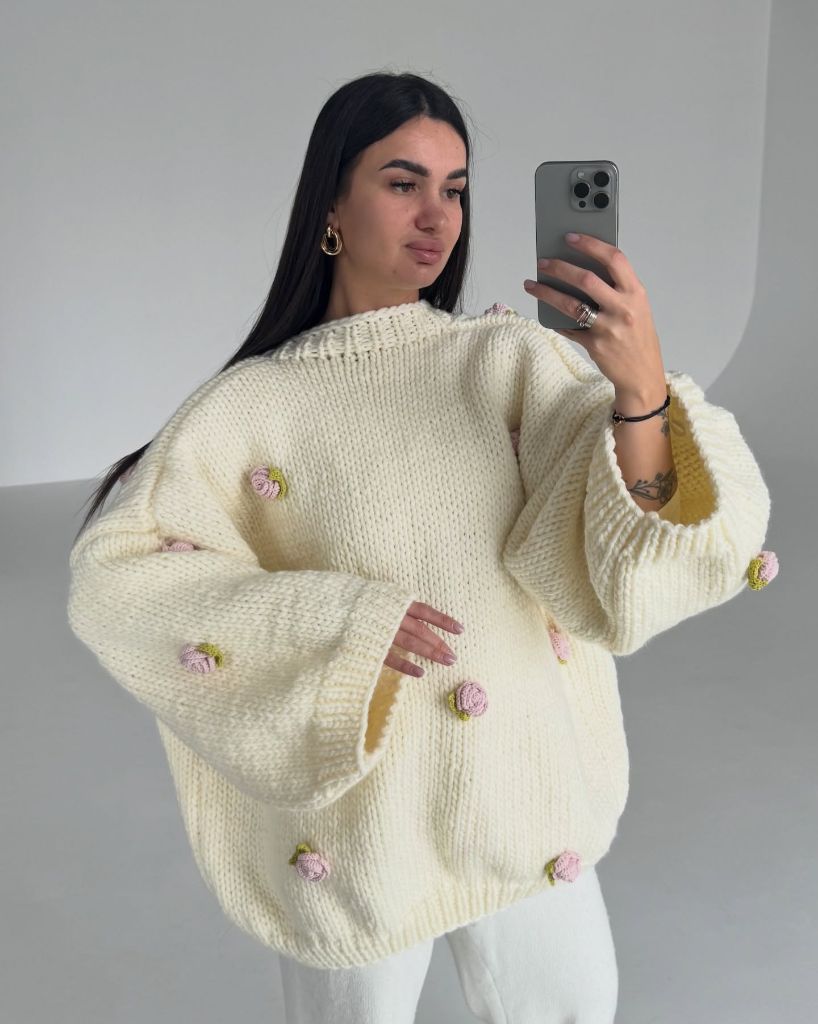 Cream chunky knit sweater with pink rosebud appliqués