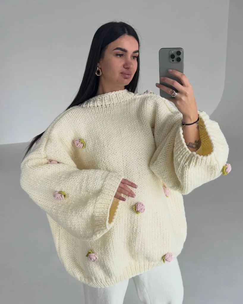 Cream chunky knit sweater with pink rosebud appliqués