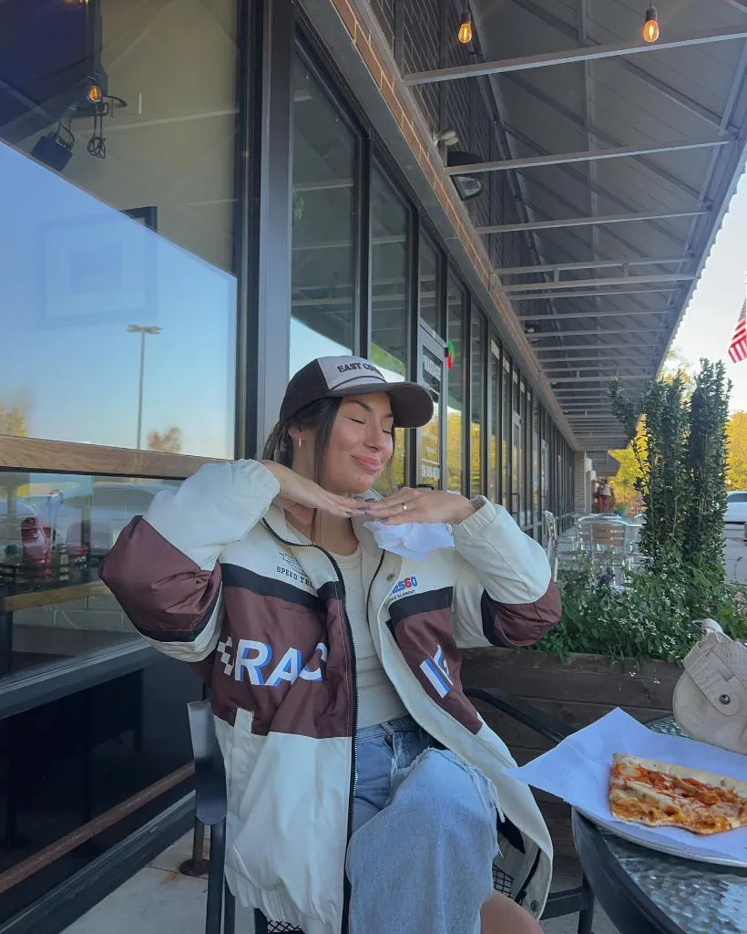 Racing jacket with jeans and trucker hat