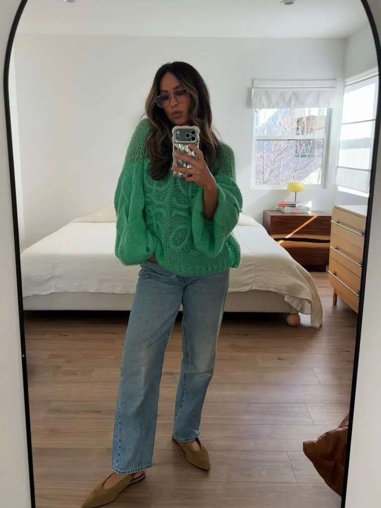 Bright green chunky knit sweater with jeans