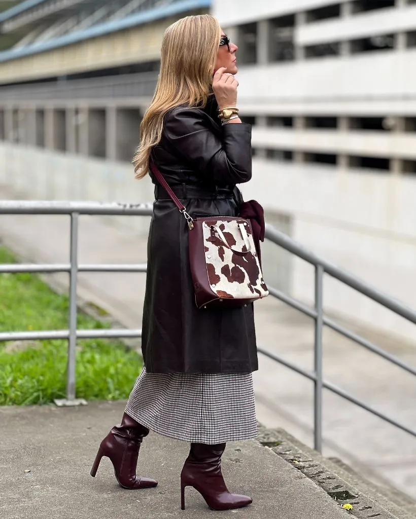 Burgundy leather trench over houndstooth midi skirt with burgundy heeled boots