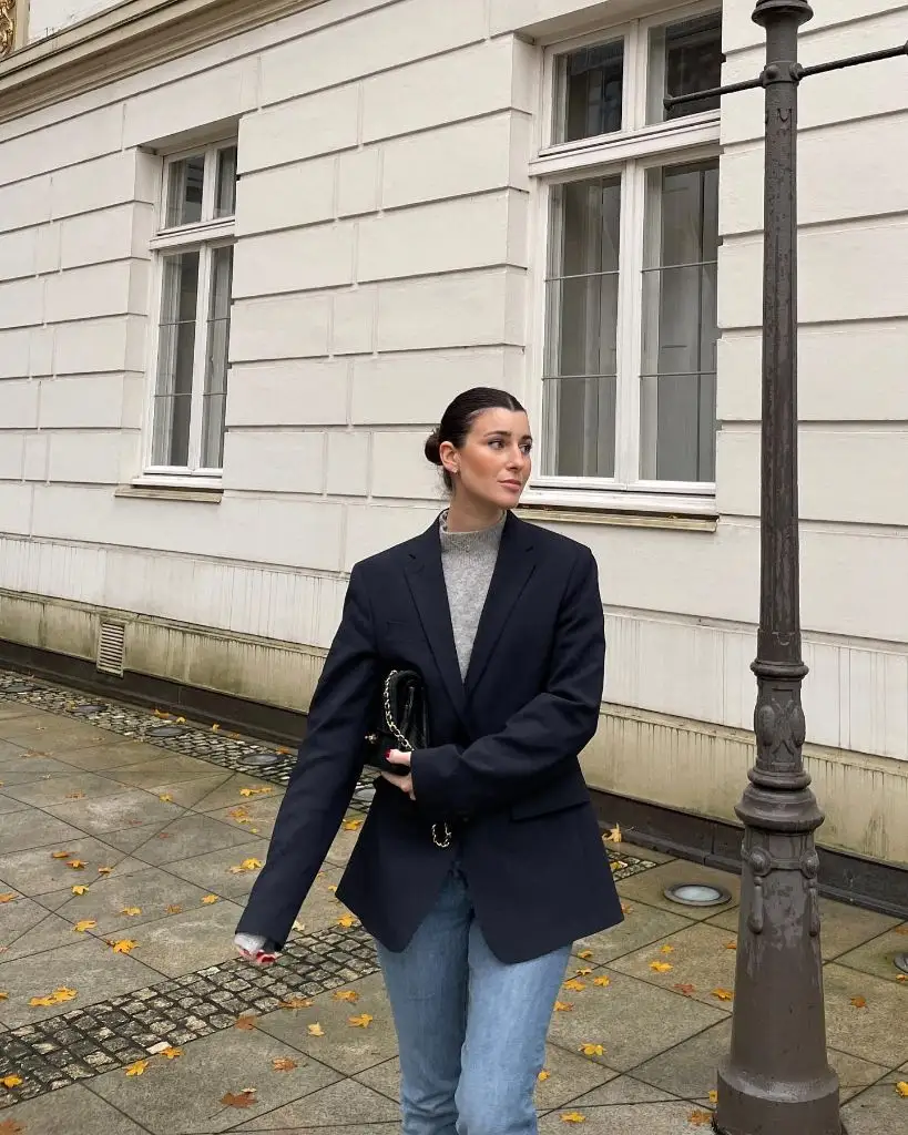 Navy blazer with grey sweater and jeans
