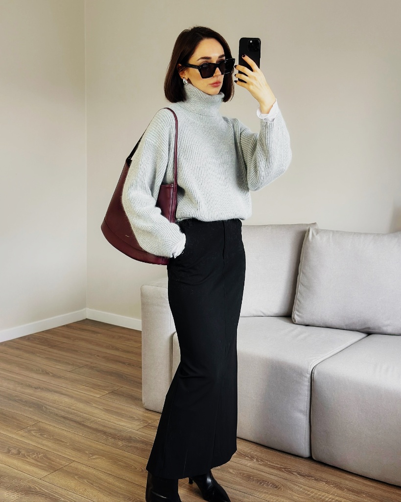 Grey ribbed turtleneck with black midi skirt and burgundy shoulder bag