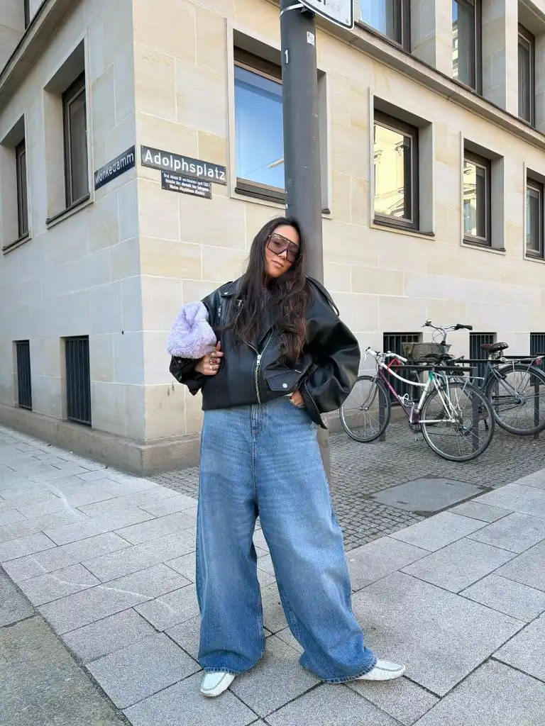 Black leather jacket and wide jeans
