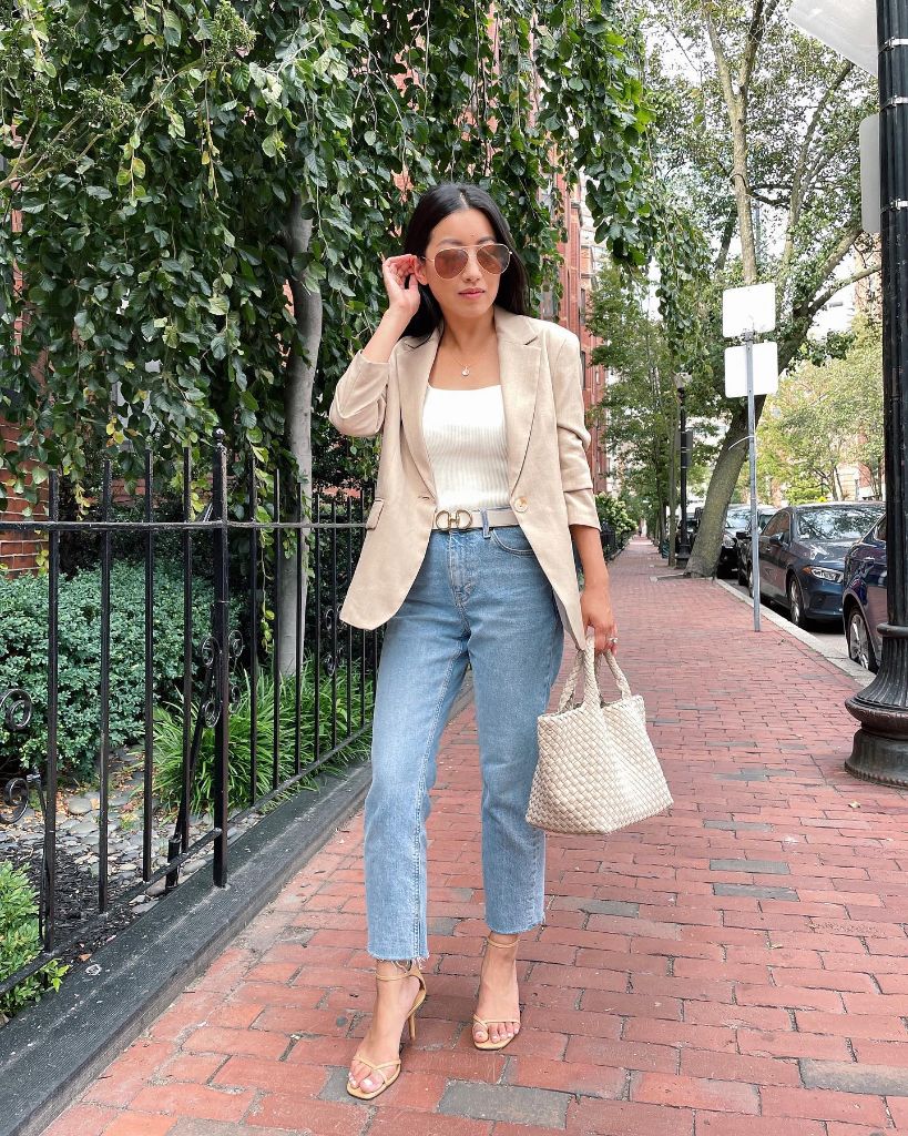 Beige linen blazer over white camisole with light-wash cropped jeans, Dior belt, nude heeled sandals, and woven tote