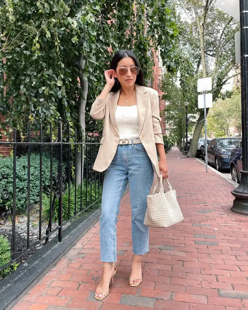 Beige linen blazer over white camisole with light-wash cropped jeans, Dior belt, nude heeled sandals, and woven tote