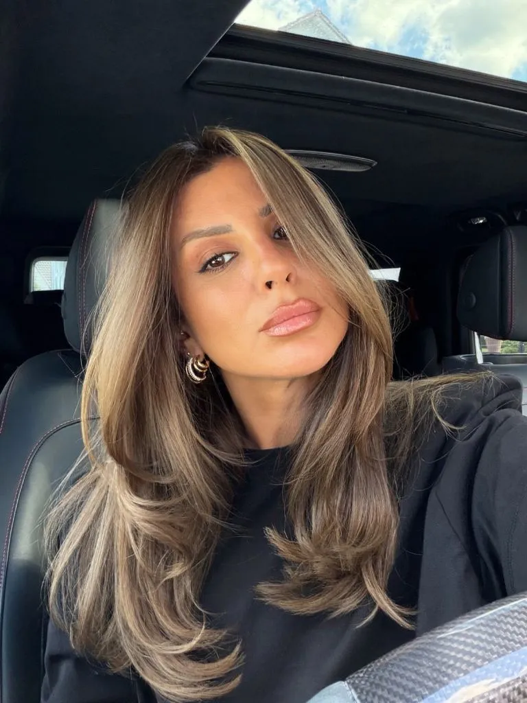 Fall Haircuts for Women 2026 Bronde Butterfly Layers with Warm Dimension and Bouncy Blowout