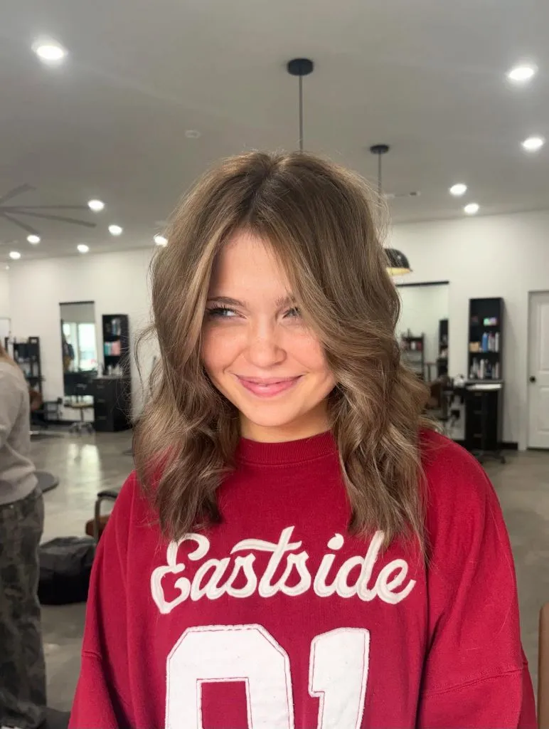 Fall Medium Haircuts 2026 Tousled Honey Shag with Voluminous Curtain Bangs