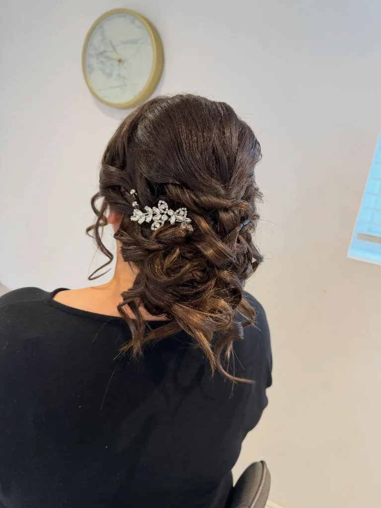 Fall Hairstyles for Office 2026 Textured Romantic Low Bun with Crystal Hair Comb