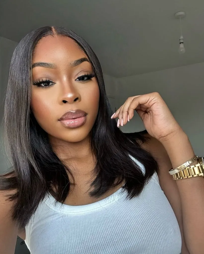 Fall Hair Colors for Black Women 2026 Shoulder-Length Natural Black With Polished Body and Bounce