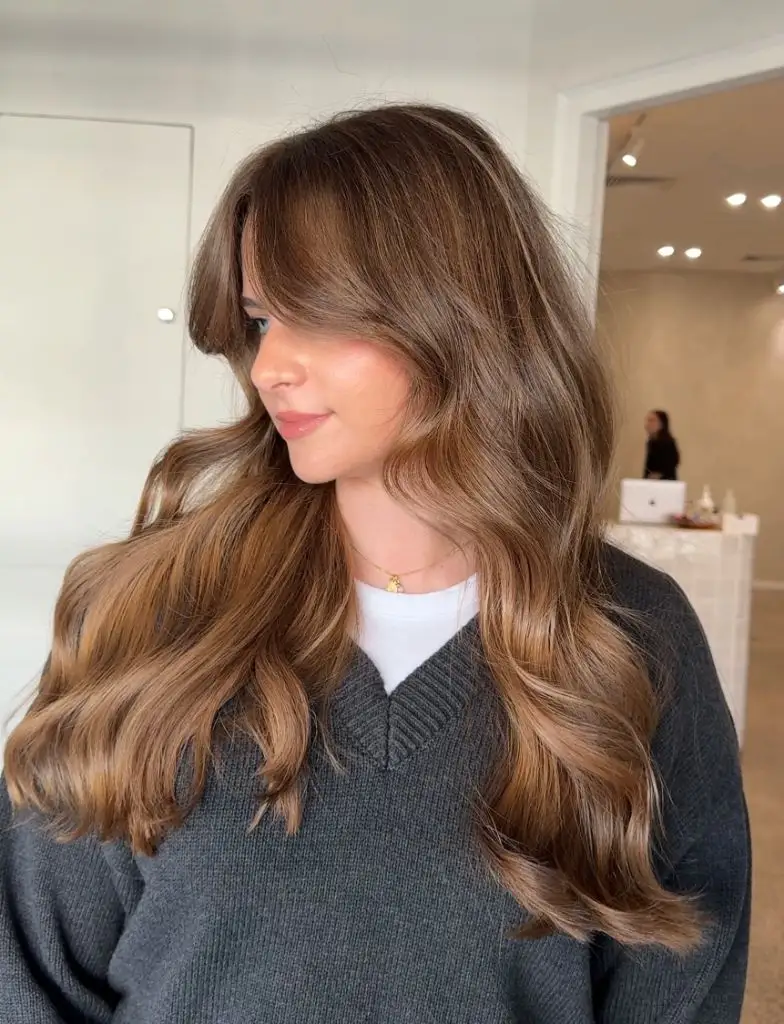 Fall Brunette Hair Colour 2026 Rich Cinnamon Balayage With Soft Curtain Bangs