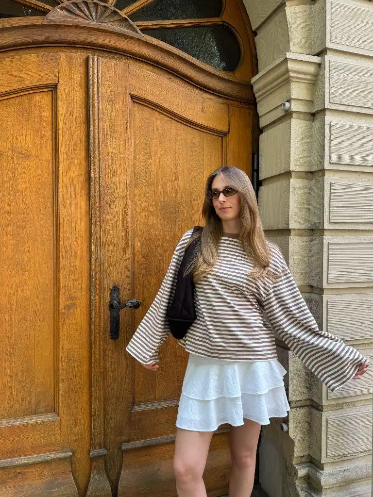 Striped top and white skirt outfit